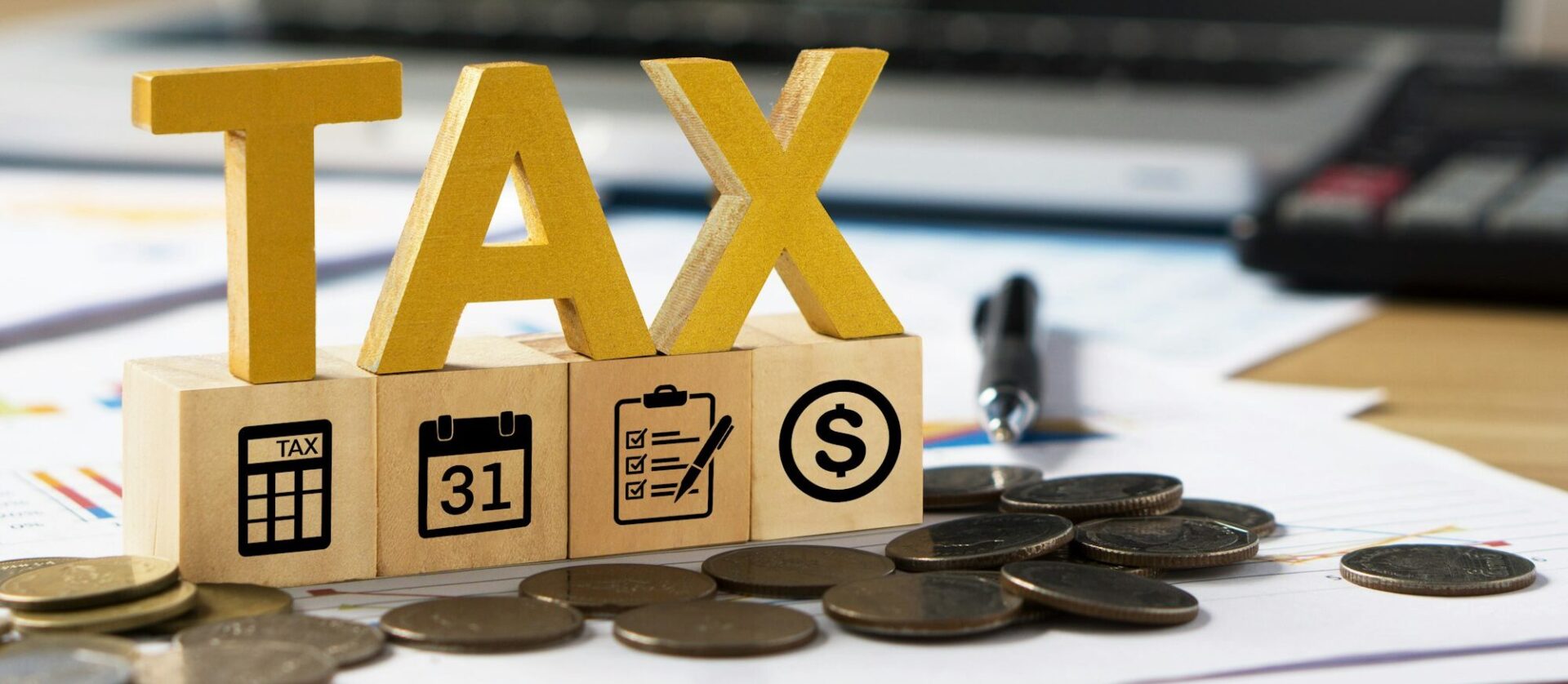 Tax wooden letter and tax icon on wooden block.Pay tax in new year.